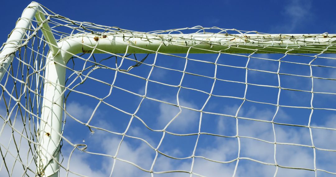 Soccer Goalpost and Net Against Clear Blue Sky - Free Images, Stock Photos and Pictures on Pikwizard.com