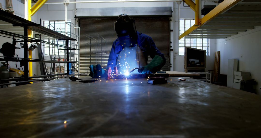 Skilled Welder Creating Sparks during Workshop Project - Free Images, Stock Photos and Pictures on Pikwizard.com