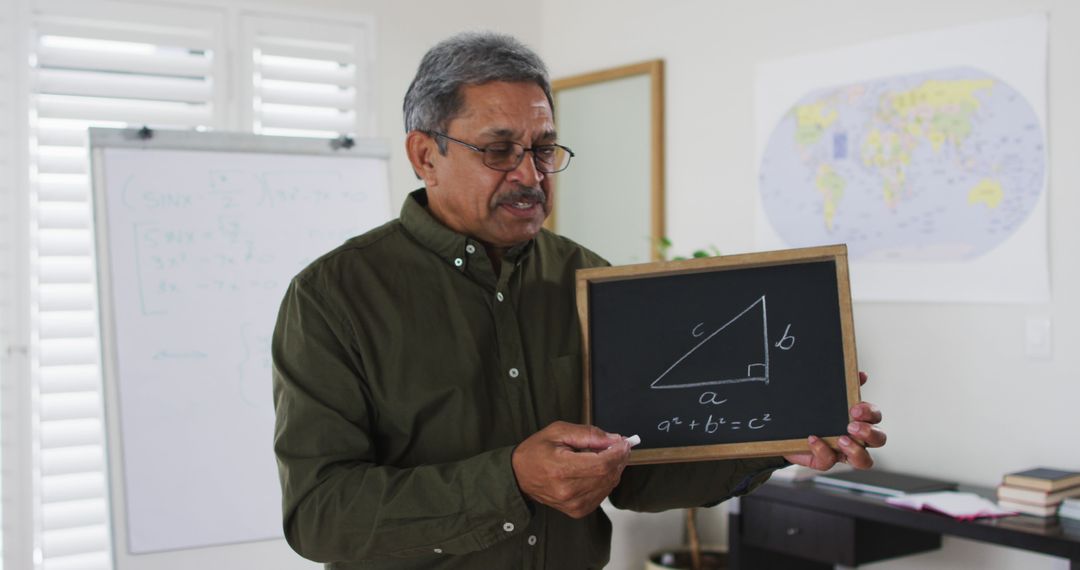 Biracial male teacher standing at a whiteboard giving an online lesson to camera - Free Images, Stock Photos and Pictures on Pikwizard.com