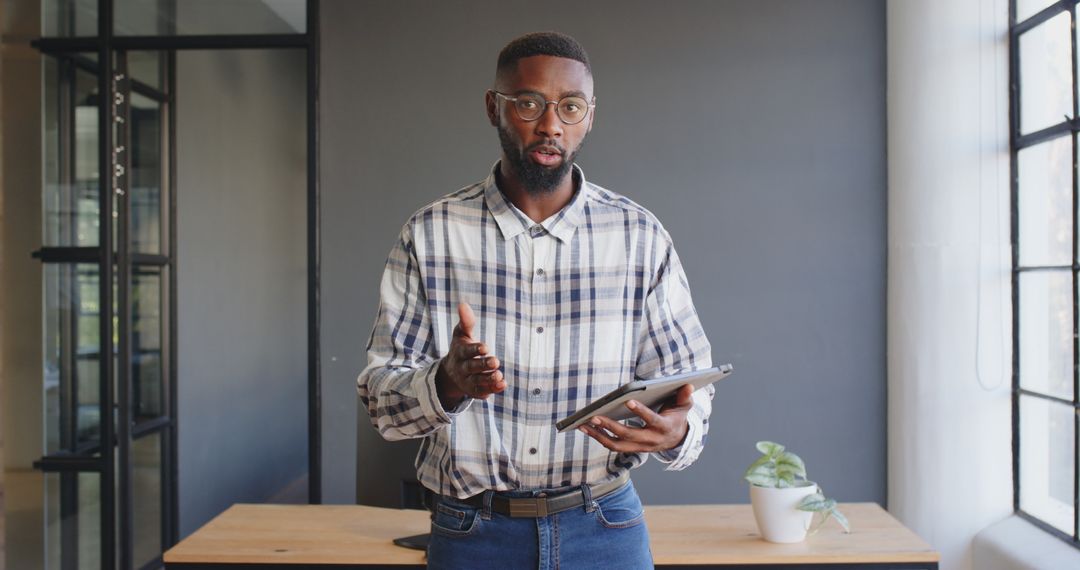 Business Professional Analyzing Data with Tablet in Modern Office