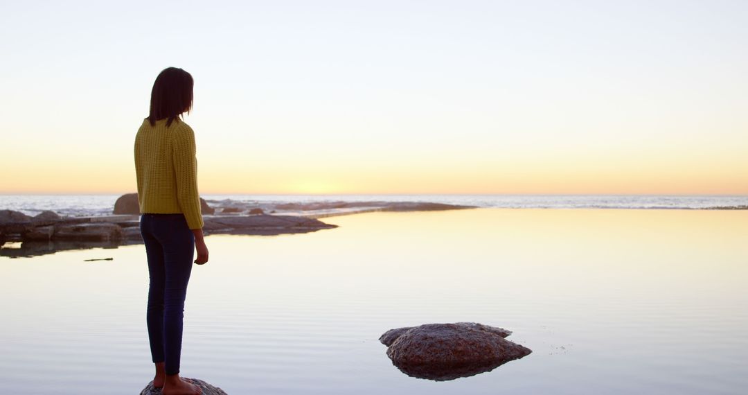 Woman Standing by Peaceful Lake at Sunset - Free Images, Stock Photos and Pictures on Pikwizard.com