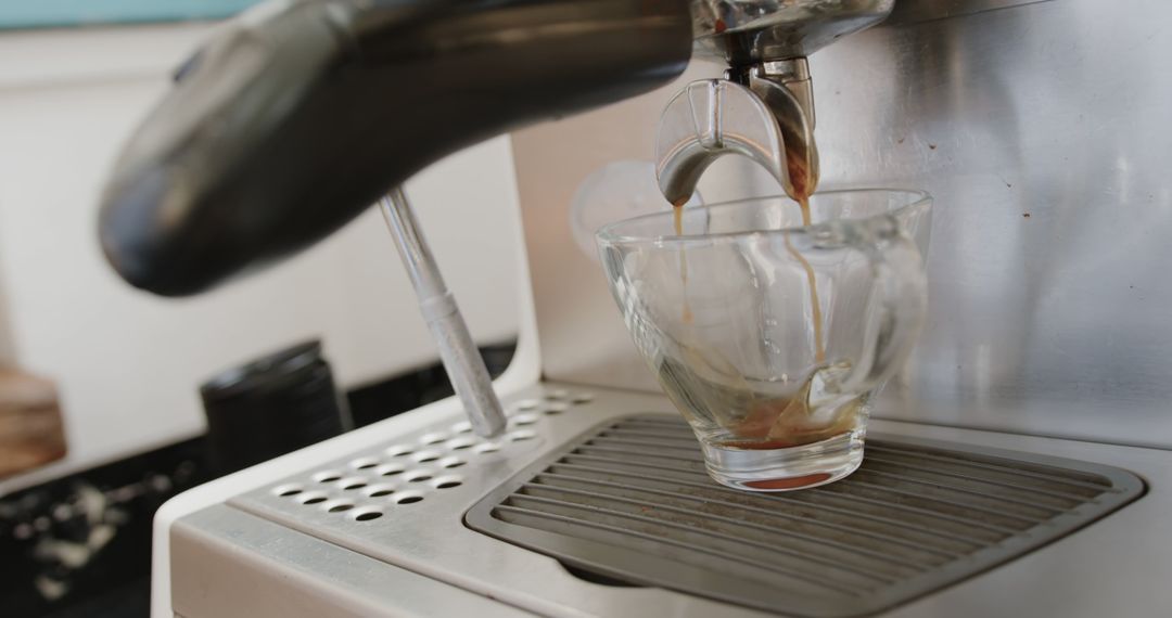 Close-Up of Espresso Machine Pouring Coffee into Cup - Free Images, Stock Photos and Pictures on Pikwizard.com