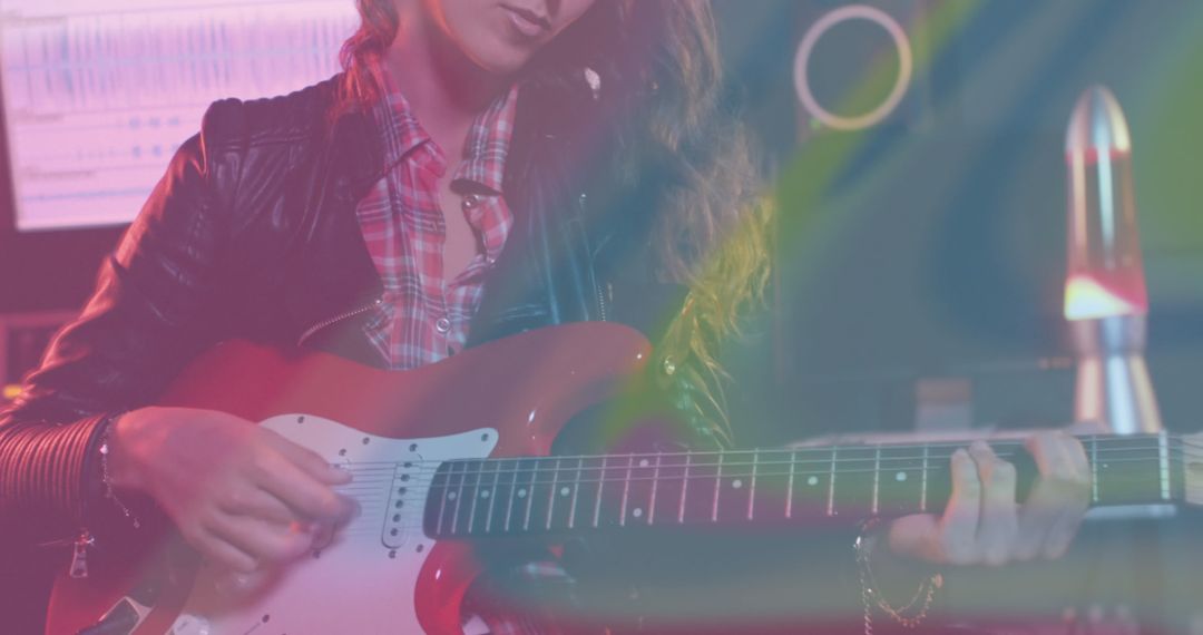 Female Guitarist Creating Vibrant Music in Studio - Free Images, Stock Photos and Pictures on Pikwizard.com