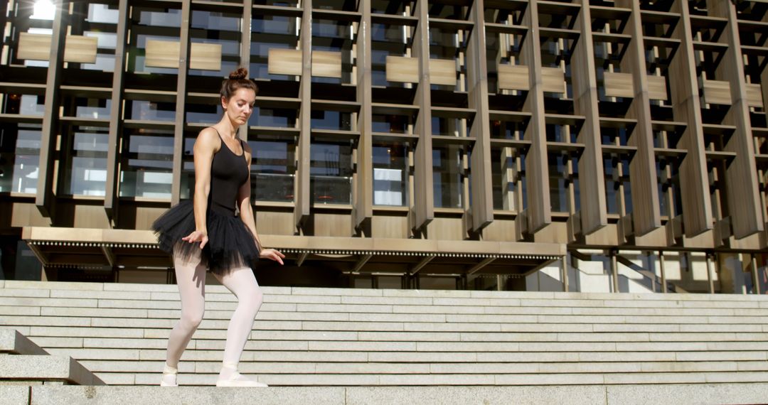 Focused Ballerina Practicing Outside on Steps - Free Images, Stock Photos and Pictures on Pikwizard.com