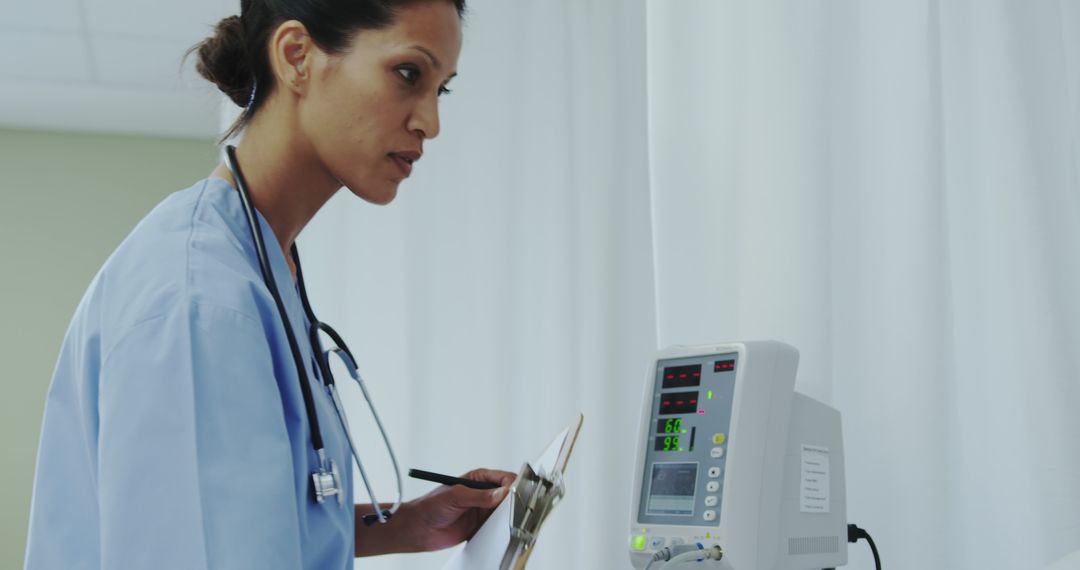 Nurse Monitoring Patient's Vital Signs on Medical Equipment - Free Images, Stock Photos and Pictures on Pikwizard.com