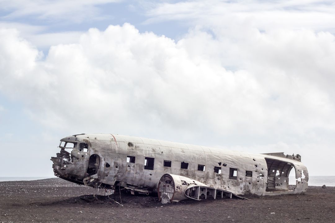 Dc-3 plane crash wreck on solheimasandur beach under cloudy sky