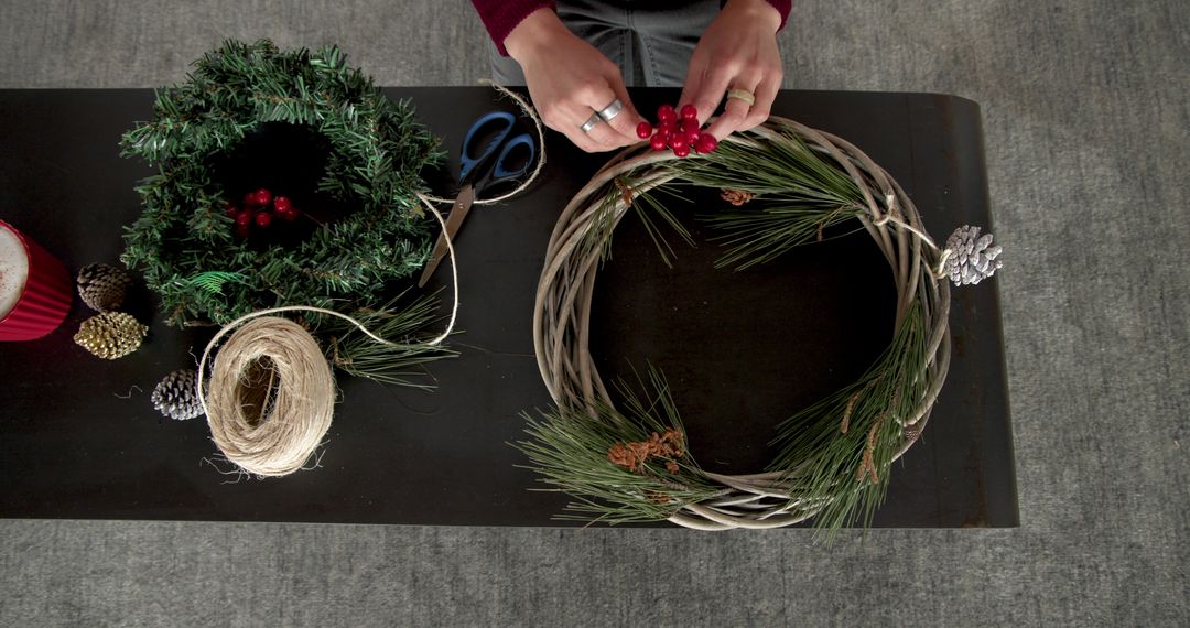 Creative Hands Garlanding Grapevine Wreath with Pine and Berries