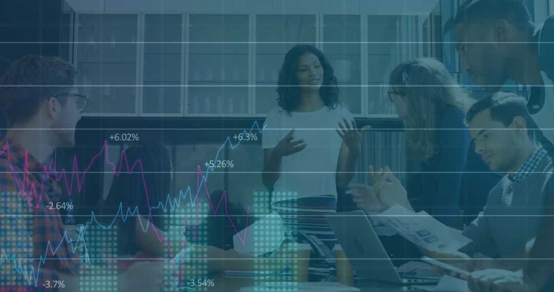 Diverse Team Analyzing Charts in Modern Office