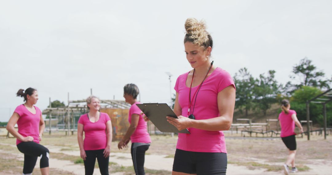 Female Fitness Instructor Leading Outdoor Group Exercise - Free Images, Stock Photos and Pictures on Pikwizard.com