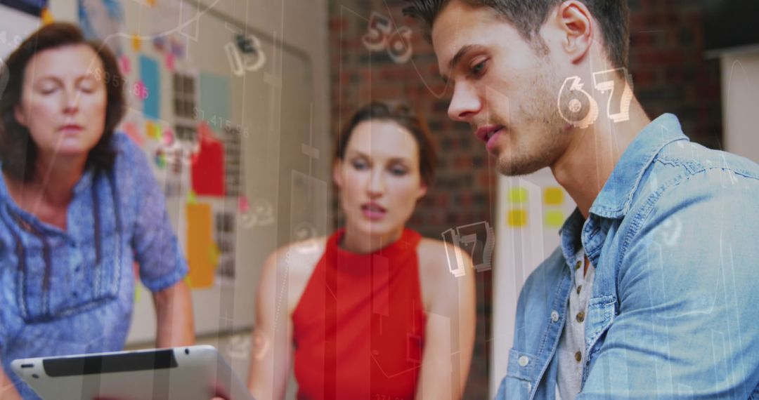 Team Collaborating on Digital Project with Tablet in Modern Office