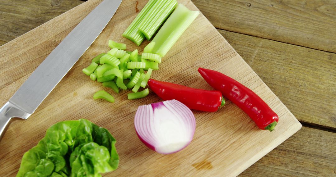 Preparing Fresh Vegetables on Wooden Cutting Board in Kitchen - Free Images, Stock Photos and Pictures on Pikwizard.com