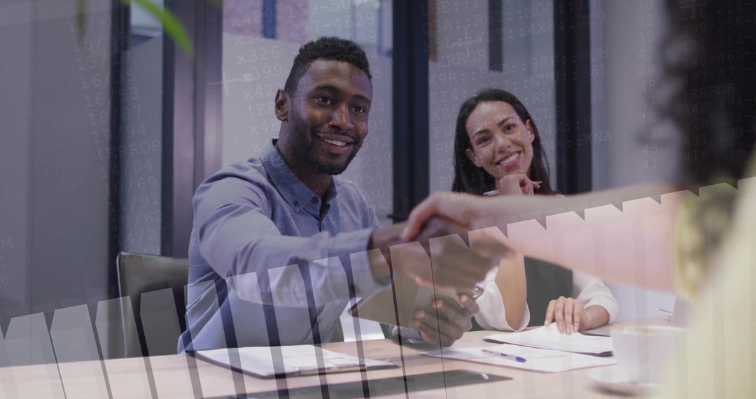 Professional Handshake at Modern Business Meeting Table