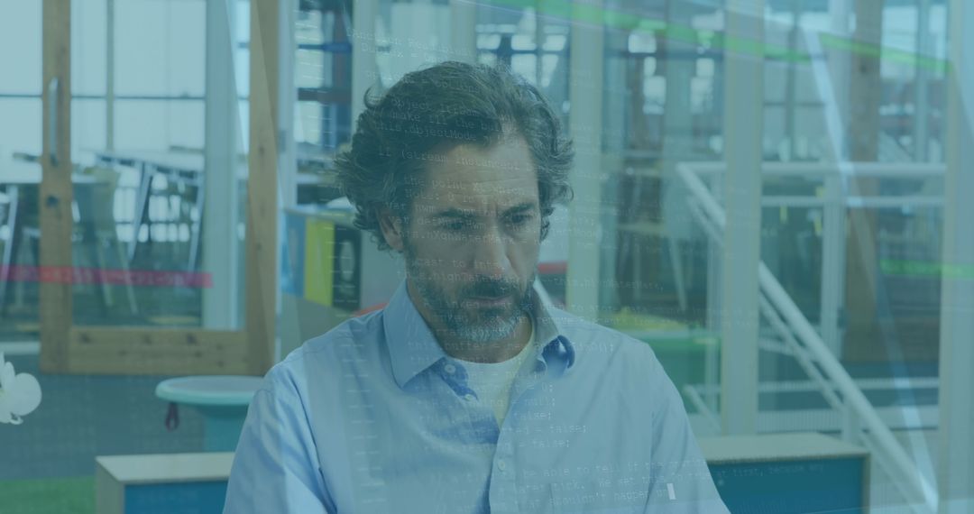 Senior Man Using Laptop in Office with Data Overlay