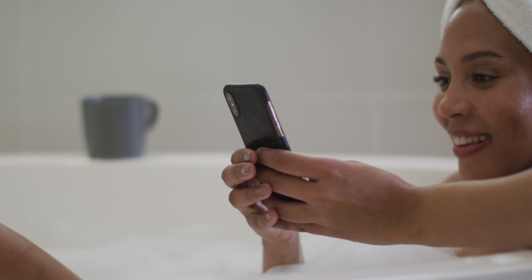 Young Woman Relaxing in Bathtub Using Smartphone - Free Images, Stock Photos and Pictures on Pikwizard.com