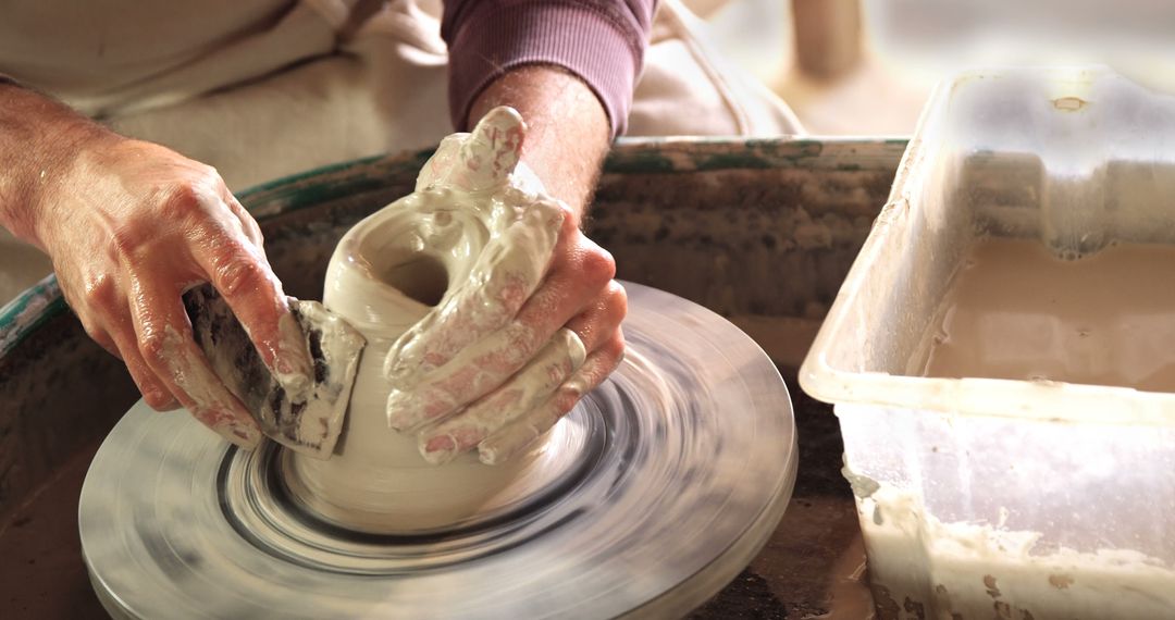 Close-up of artisan shaping clay on pottery wheel - Free Images, Stock Photos and Pictures on Pikwizard.com