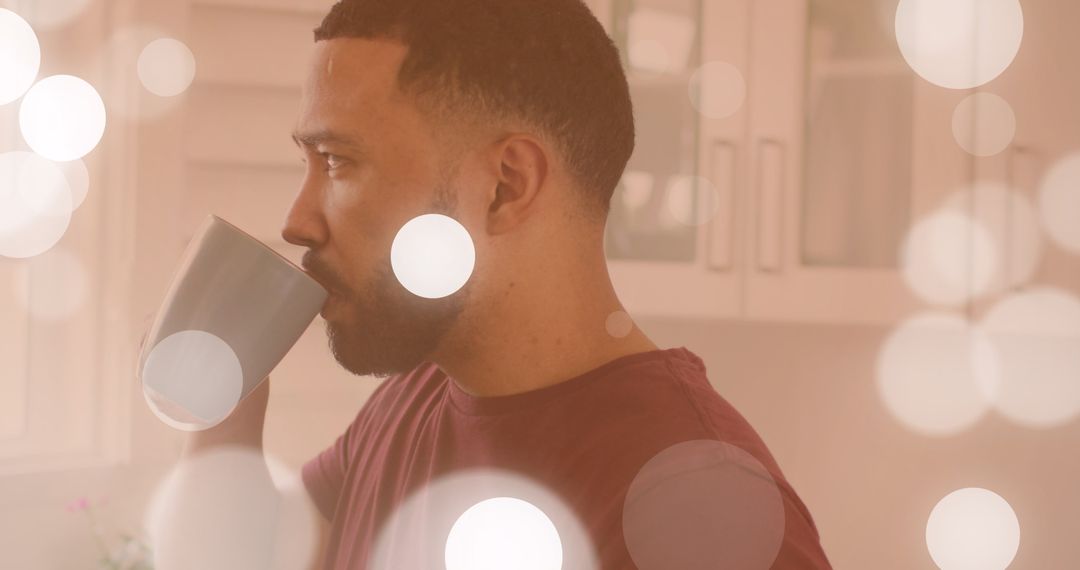Man Relaxing with Coffee Amid Digital Bokeh Effects