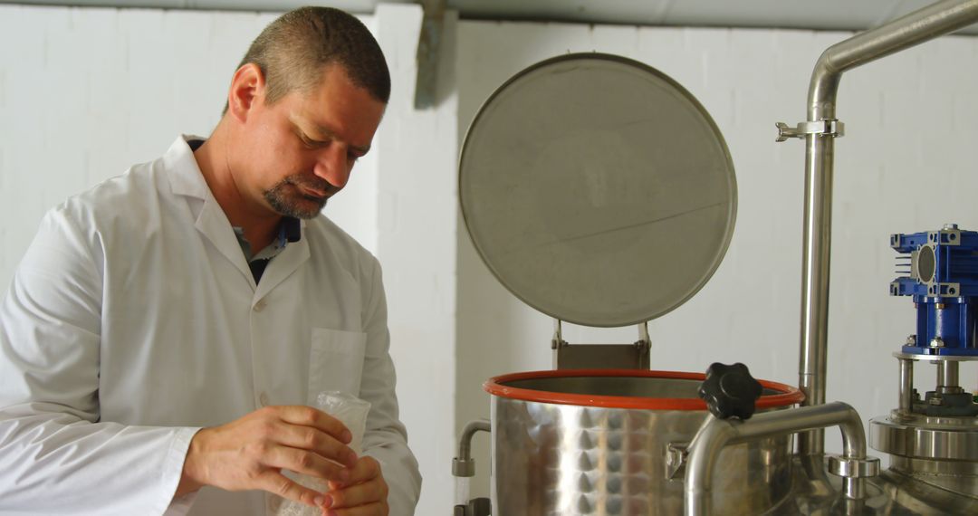 Scientist Working in Laboratory on Industrial Equipment - Free Images, Stock Photos and Pictures on Pikwizard.com