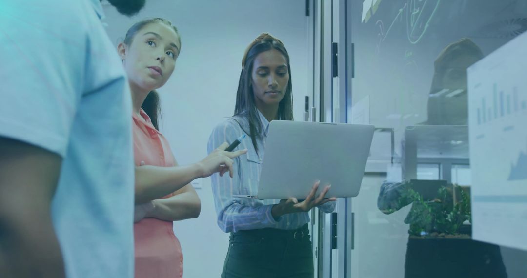 Team Collaborating on Data Visualization in Modern Office