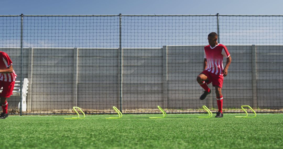 Young Soccer Players Engaging in Agility Training on Field - Free Images, Stock Photos and Pictures on Pikwizard.com