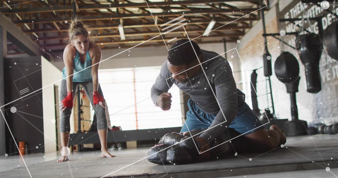 Boxing Trainer Supervising Boxer Practicing Punching Techniques