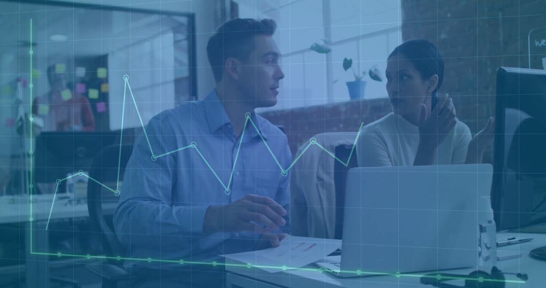 Business Team Analyzing Financial Charts in Modern Office Environment