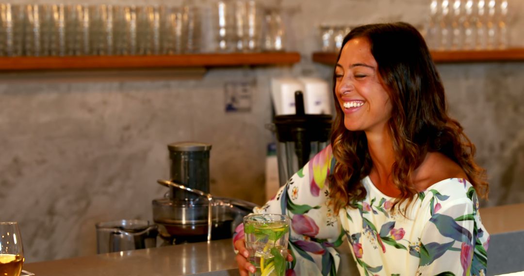 Woman Enjoying Refreshing Drink at Stylish Bar Counter