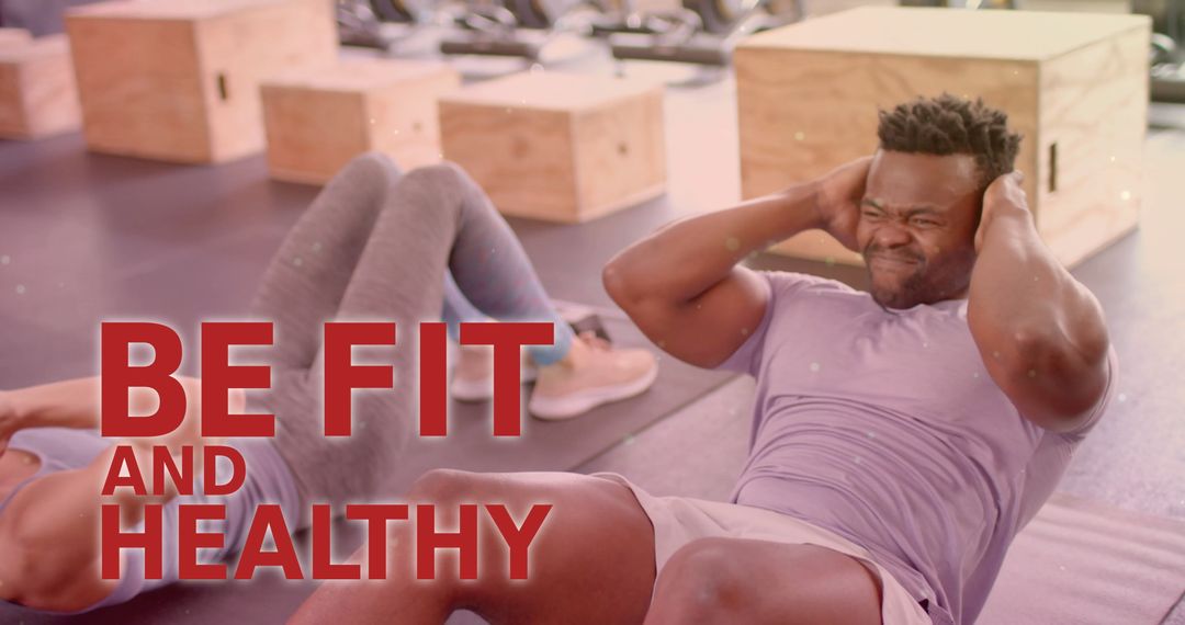 Diverse Fitness Enthusiasts Exercising in Gym Setting