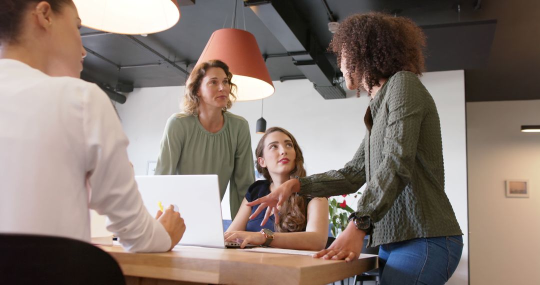 Diverse Female Professionals Collaborating in Modern Office Meeting