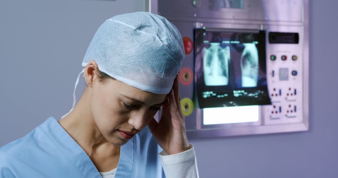 Worried Female Doctor Reflecting In Front Of X-Ray Displays - Free Images, Stock Photos and Pictures on Pikwizard.com