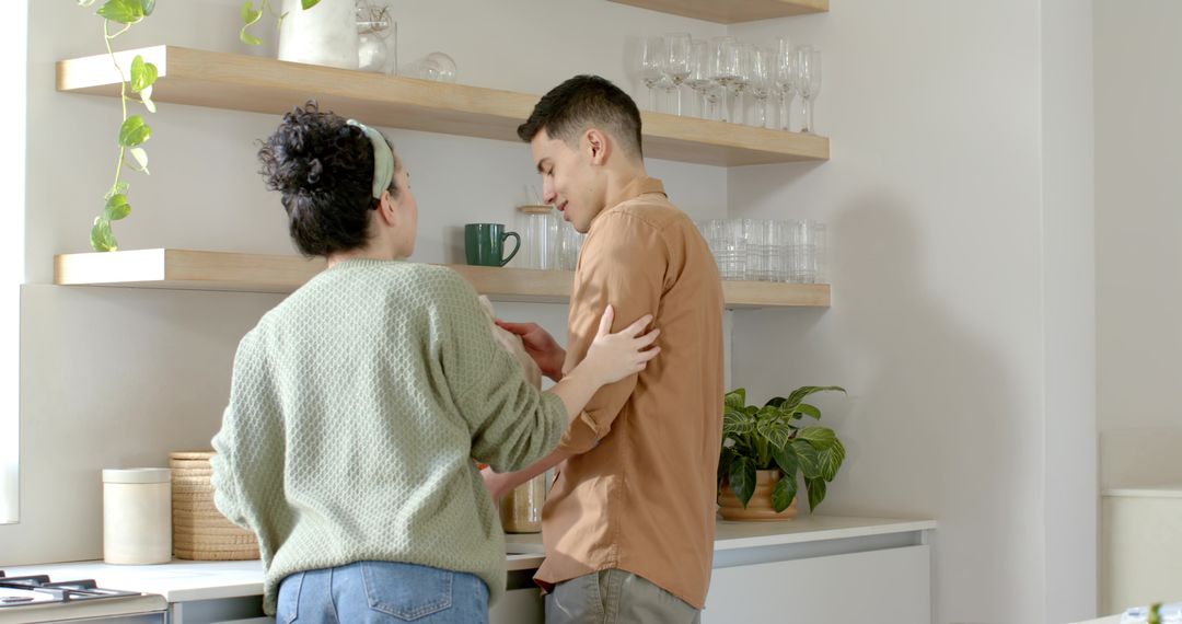 Couple Engaging in Discussion in Modern Minimalist Kitchen
