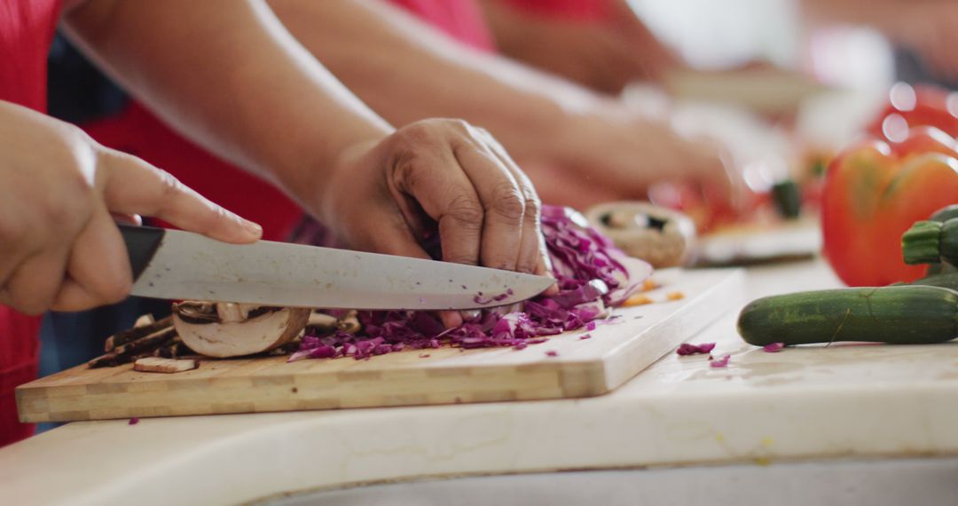Senior Hands Chopping Cabbage in Active Cooking Session