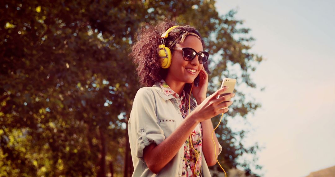 Cheerful Woman Enjoying Music Outdoors with Headphones