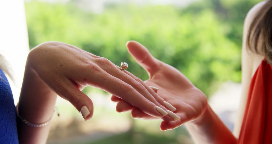 Hand with Engagement Ring Being Admired Outdoors - Free Images, Stock Photos and Pictures on Pikwizard.com