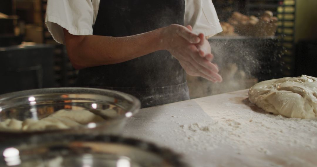 Baker Preparing Dough with Flour in Bakery - Free Images, Stock Photos and Pictures on Pikwizard.com