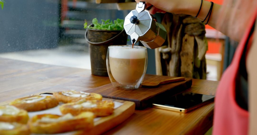 Person Pouring Fresh Coffee into Cup at Cozy Cafe - Free Images, Stock Photos and Pictures on Pikwizard.com