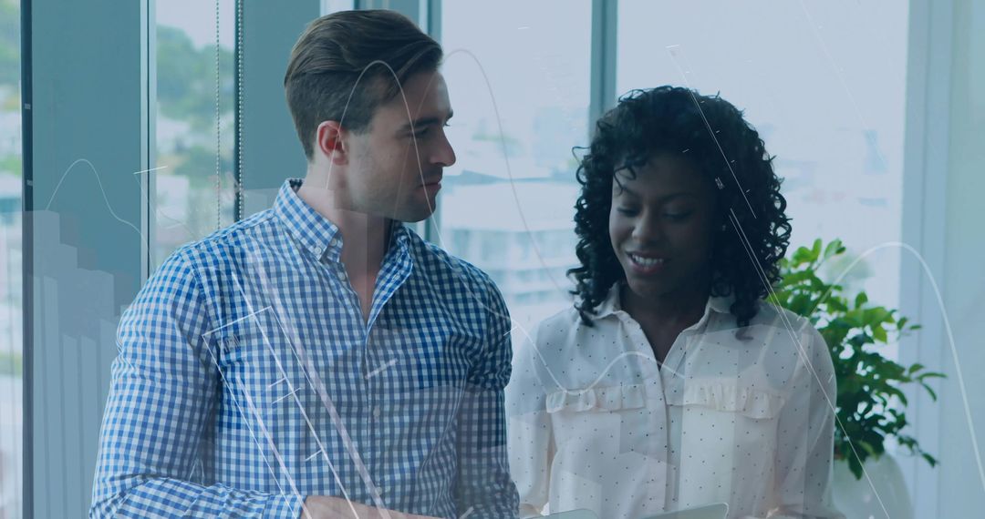 Business Professionals Discussing Data in Modern Office Environment