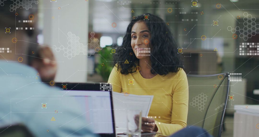 Professional Woman Collaborating in Modern Office with Data Graphics