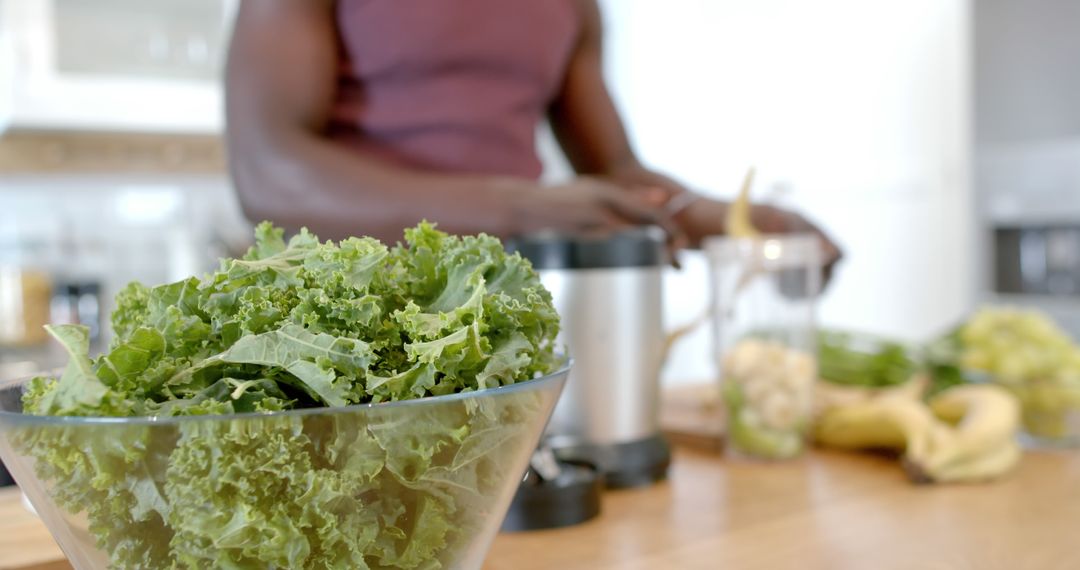 Man Preparing Kale Smoothie in Modern Kitchen - Free Images, Stock Photos and Pictures on Pikwizard.com