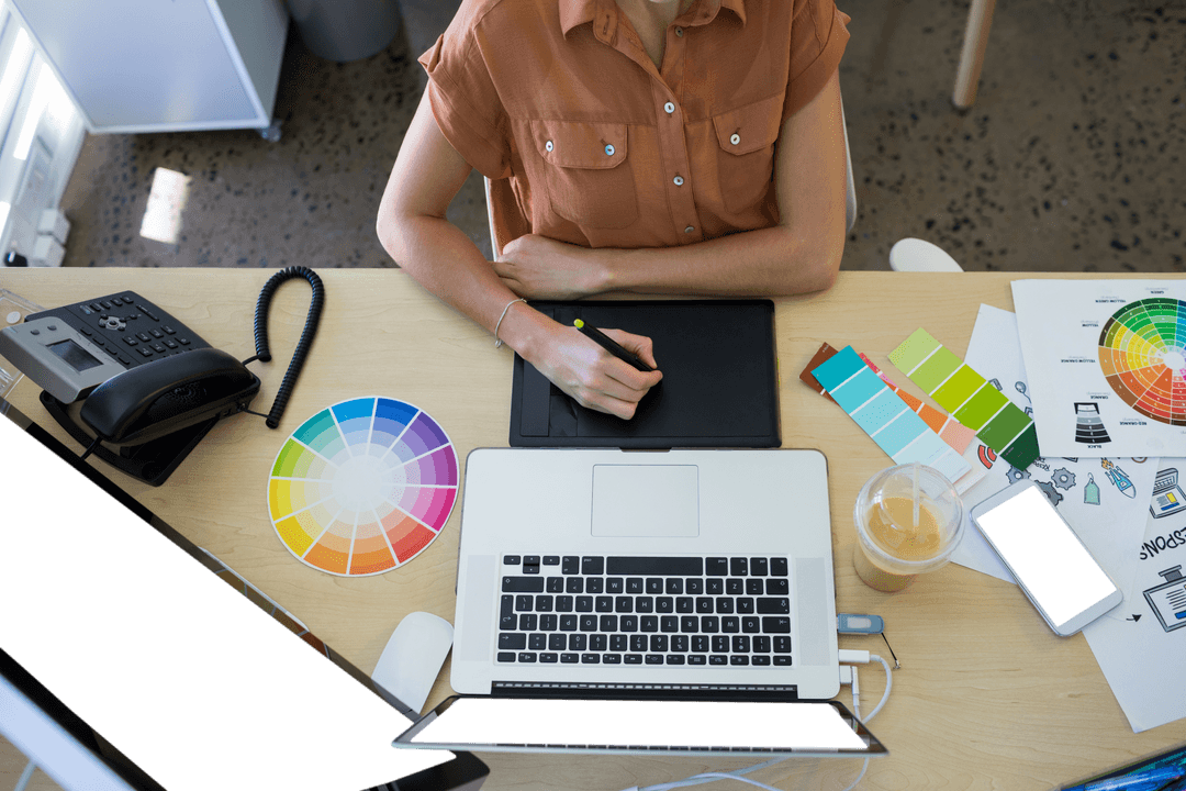 Businesswoman Using Graphic Tablet at Desk in Modern Office Setting Transparent