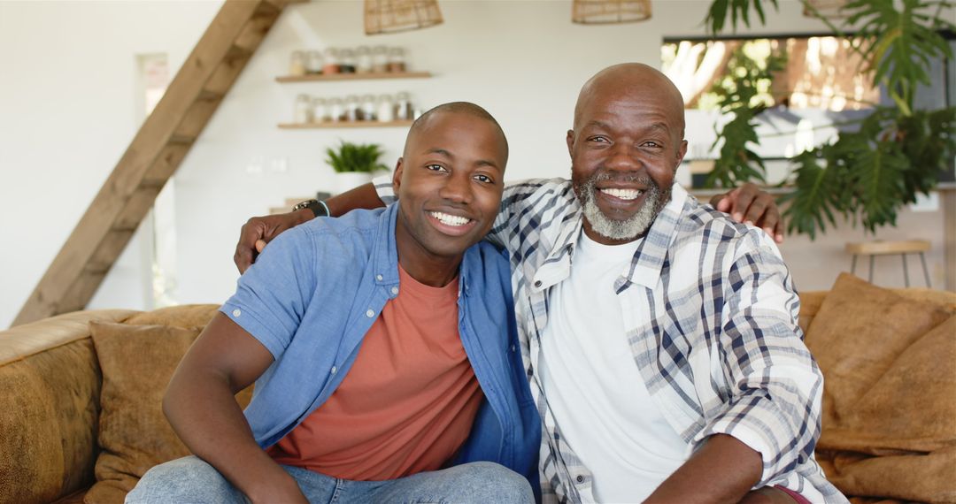 Smiling Father and Son Enjoying Quality Time on Couch