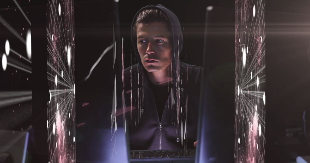 Hacker in Hoodie Analyzing Digital Connections Across Screens
