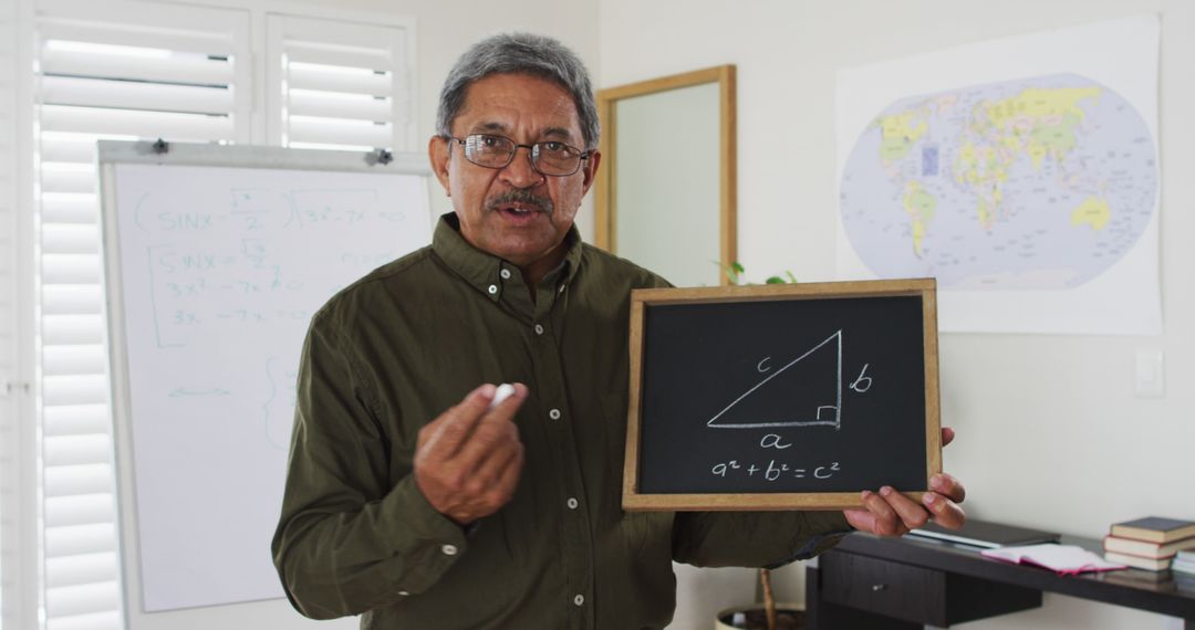 Biracial male teacher standing at a whiteboard giving an online lesson to camera - Free Images, Stock Photos and Pictures on Pikwizard.com