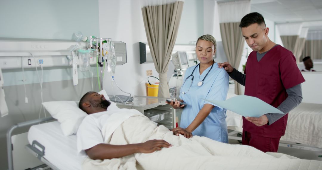 Nurses Checking Patient's Medical Records in Hospital Room - Free Images, Stock Photos and Pictures on Pikwizard.com