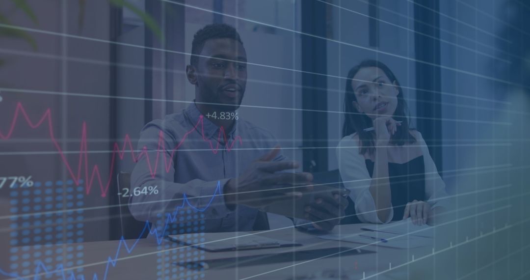 Diverse Business Team Reviewing Financial Data with Charts Overlay