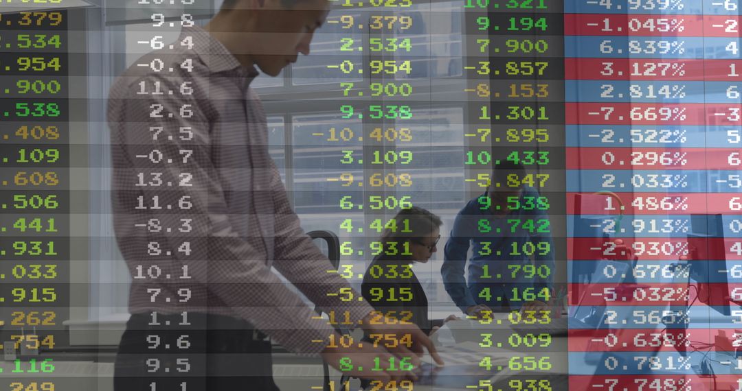Team Analyzing Financial Data on Digital Display in Office