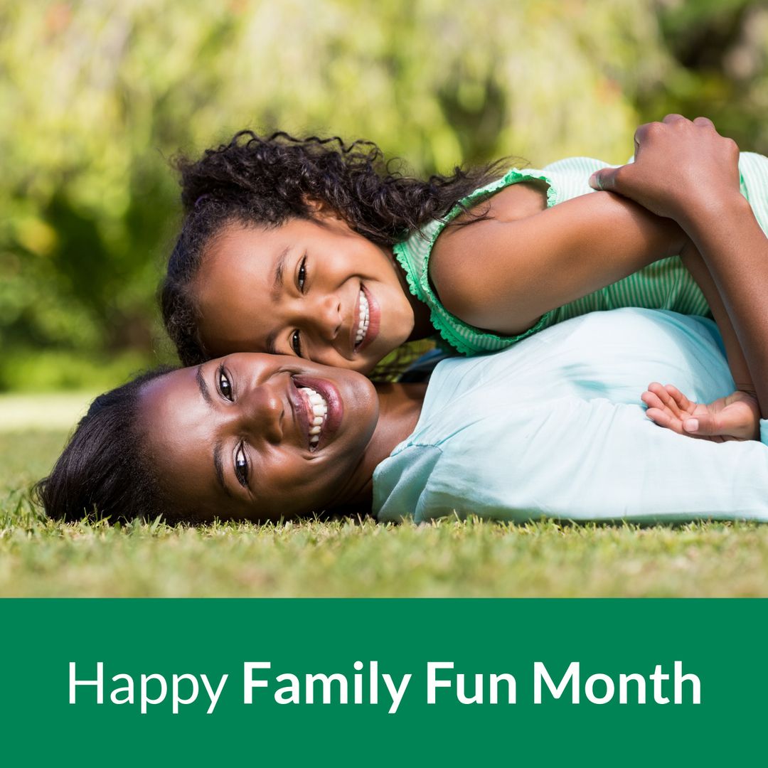 Joyful Mother and Daughter Embracing in Park for Family Fun Month