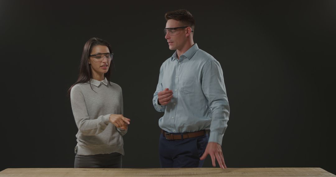Business Colleagues Discuss Project at Workplace Table