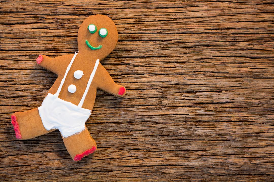 Gingerbread Man on Rustic Wooden Background - Free Images, Stock Photos and Pictures on Pikwizard.com