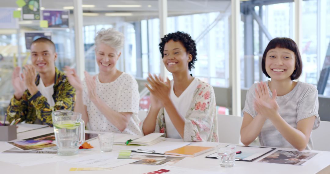 Diverse Team Applauding Successful Presentation in Modern Office