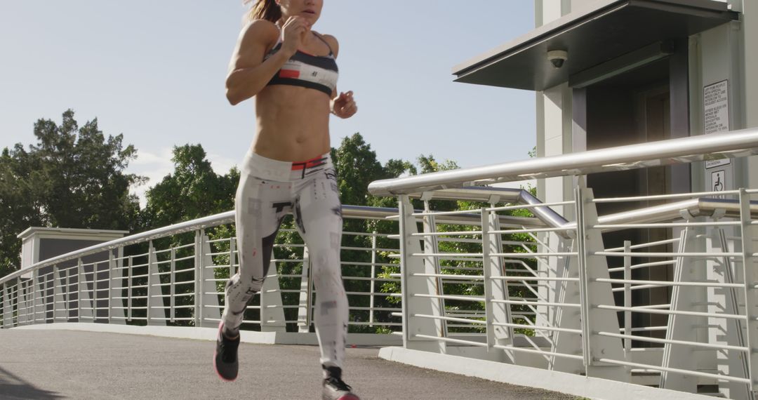 Young Woman Jogging Outdoors in Urban Area - Free Images, Stock Photos and Pictures on Pikwizard.com